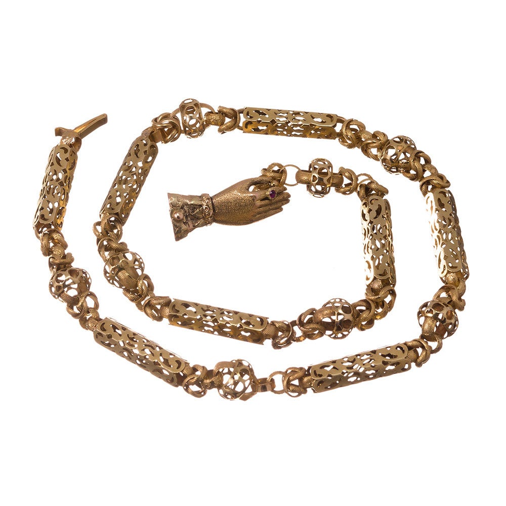 Immaculate Georgian link necklace made of 15k yellow gold and measuring 16.25 inches long. The links are a very intricate design combining open golden barrels with undulating orbs. There is an enormous amount of detail- look closely to see the star