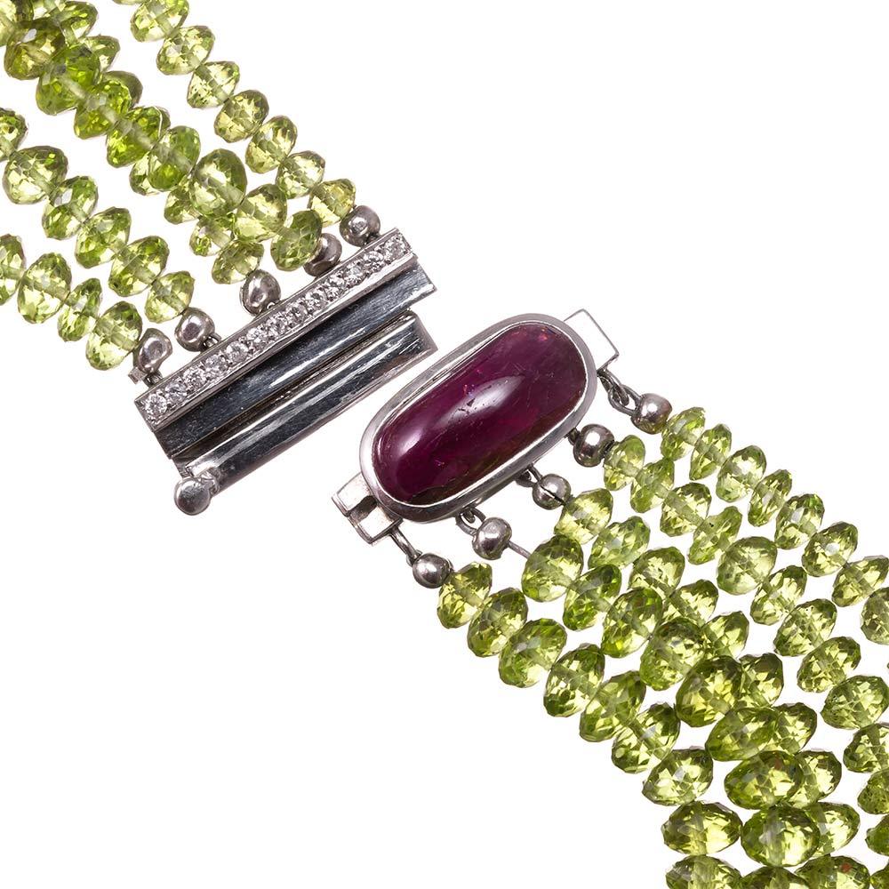 Multi-Strand Peridot Necklace with Asymmetrical Cabochon Ruby Clasp In Excellent Condition In Carmel-by-the-Sea, CA