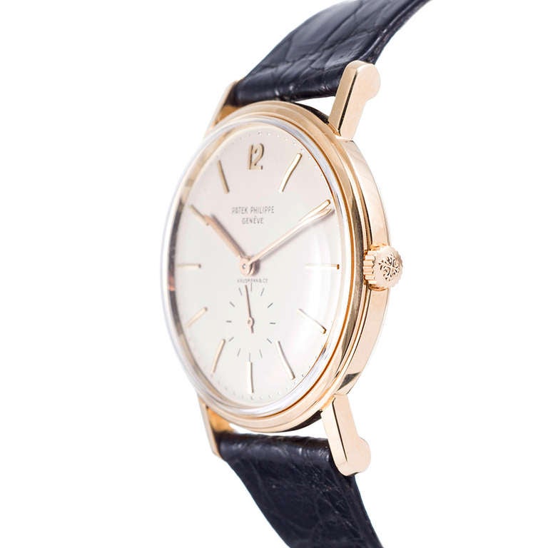 Patek Philippe 18k yellow gold wristwatch, retailed at the esteemed jeweler Hausmann in Rome. This larger-than-normal wristwatch has been guarded in super mint condition. This is an exceptional piece for the ultra-discering collector who appreciates