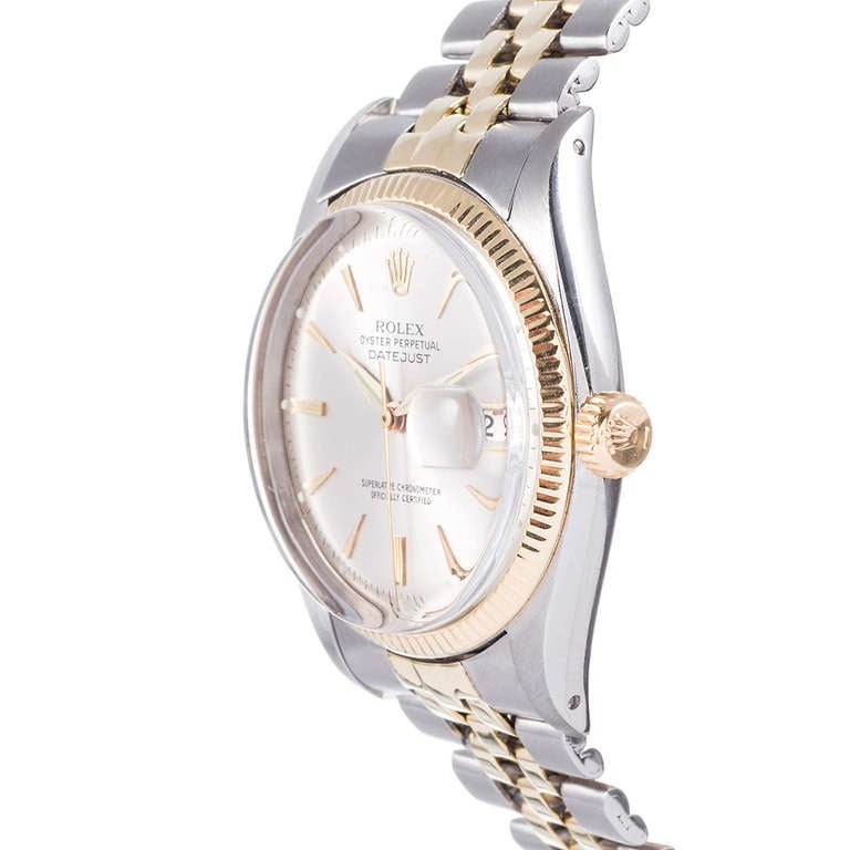 Rolex stainless steel and 18k yellow gold Datejust wristwatch, Ref. 6305, circa 1950s. This watch offers a great value for such a handsome vintage look. We have a high level of affection for these vintage pieces that bear such mid-century charm.