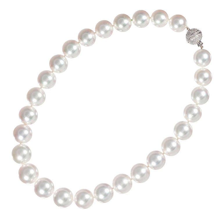 A simply beautiful rendering of the most iconic of jewelry pieces. Every well-curated jewel box needs a substantial strand of lustrous pearls! This one consists of twenty-seven white pearls which graduate from 14.0 to 16.4 millimeters. The strand