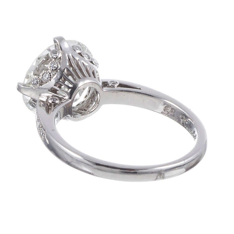 A genuine classical beauty, featuring a 3.71 carat round diamond set in a platinum mounting. The diamond is accompanied by a GIA diamond grading report stating J color and Vs2 clarity. The mounting offers just enough detail to distinguish it,