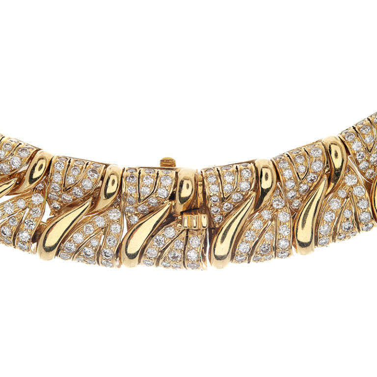 A spectacular design and creation by the historic jewelry house BULGARI. Created as a collar the design of this necklace rests prominently just below the neckline, on display for everyone to admire. Though substantial in size and weight, BULGARI