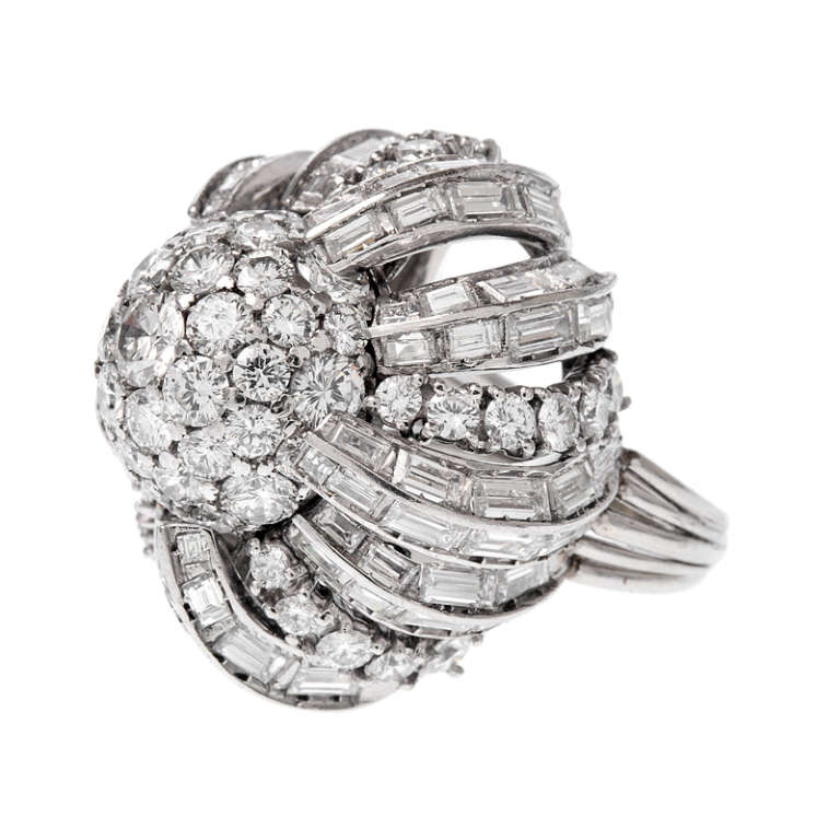 An incredible handmade ring, crafted with the finest quality in a style as beautiful as it is unique. Designed with a French sophistication, this ring is a fantastic example of an important jewel crafted in the high glamour 1950's fashion. The