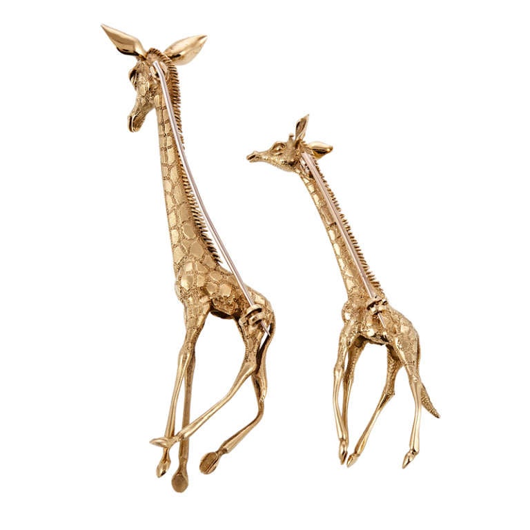 A pair of giraffes exhibiting mother and adolescent, finely designed and handmade with 