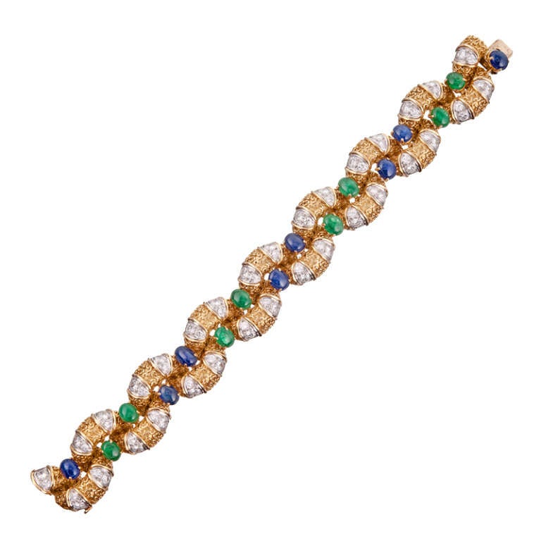 A stunning, yet wearable bracelet, fit for the most distinguished of jewelry collections. Somehow, the cabochon gemstones have an organic feeling that provides a hint of whimsy, despite the important look of this bracelet. 

 It has been hand made