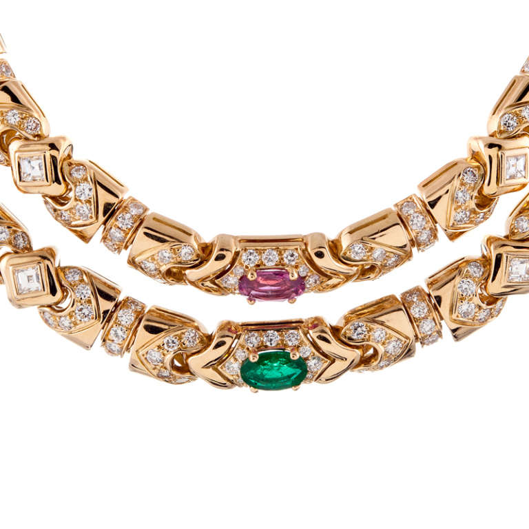 Gorgeous detail with a unique color combination of pink tourmaline and emerald, complimented by square and round diamonds. The necklace measures 17 inches in overall length, with an additional drop at the bottom. In total 464 diamonds weigh over 12