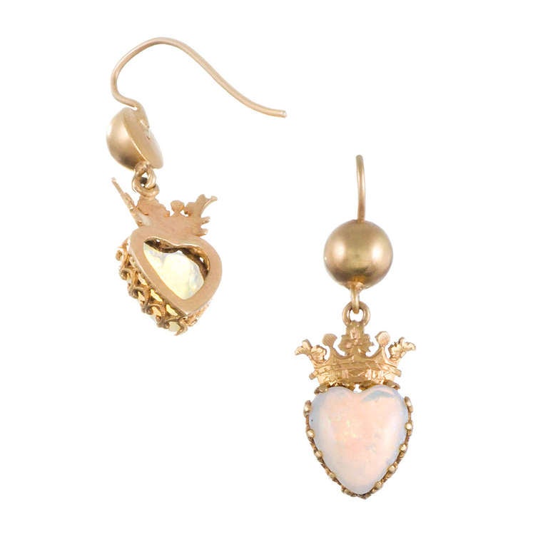 15k yellow gold English Victorian earrings consisting of a carved heart-shaped opal, suspended from a golden crown and orb. 1.25 inches long and just shy of a half inch wide… ideal for every day!