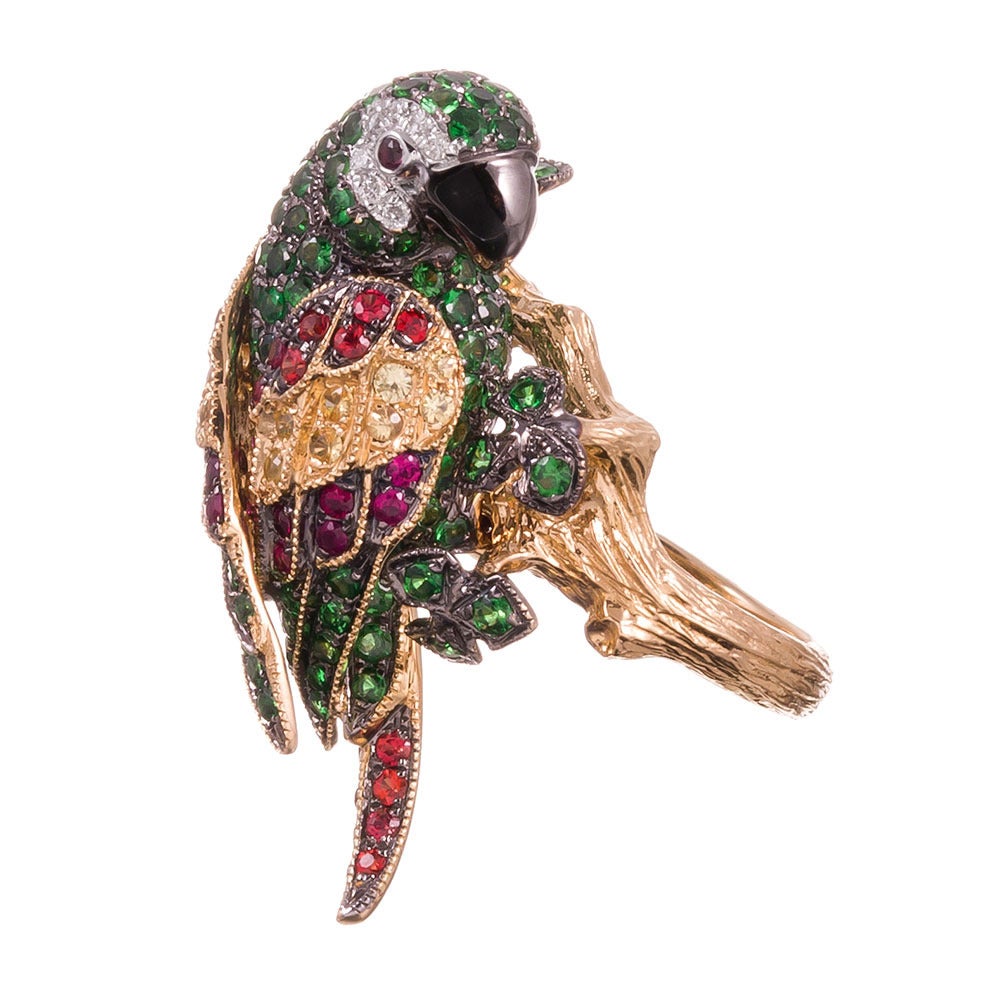 18k yellow gold ring, clearly created by someone who was both a skilled craftsperson and a fan of parrots, as we have rarely seen this motif captured with such lifelike precision. Tsavorite garnets (2.52cttw), yellow sapphires, rubies (1.22cttw