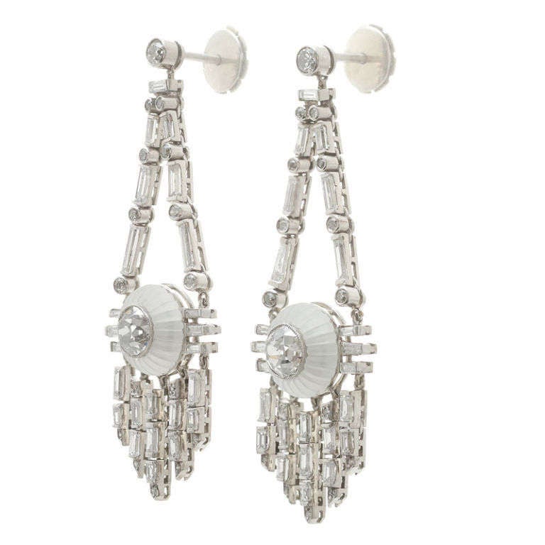 Art Deco style with a contemporary twist. These earrings are classic and chic, both wonderfully playful and decadent. A fantastic dichotomy!

- Diamonds in the center of the Rock Crystal are .80 carats each

- The 48 baguettes and 32 round