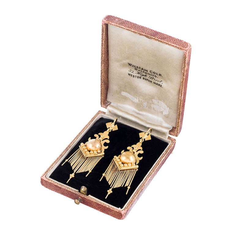 Rendered in 18k yellow gold, with lingering influences of the Etruscan Revival style, these lovely authentic Victorian drop earrings are as relevant for today's fashion-conscious as they were over a century ago. 18 karat yellow gold earrings