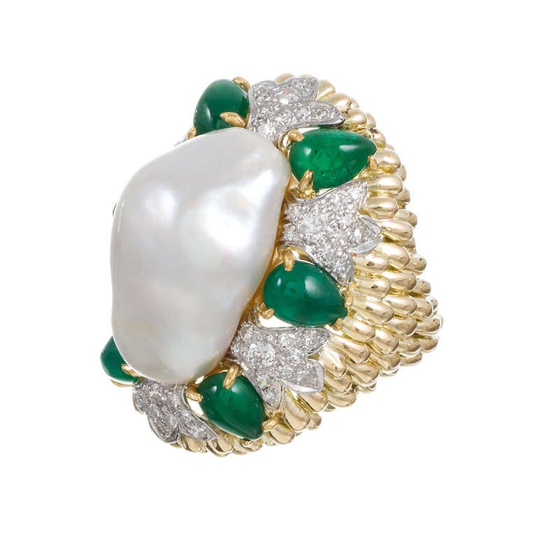 David Webb's designs are bold, sophisticated and distinctive. Capturing the character of his media and combining them with abundant artistic success, he does not fail to impress with this fantastic ring. 18k yellow gold, with a large baroque pearl