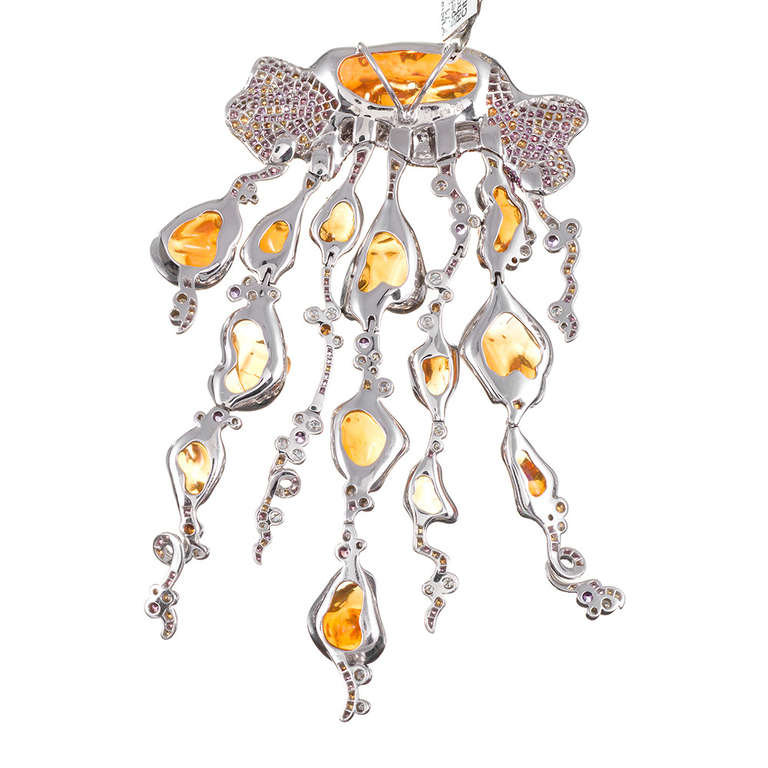 An unusual and distinctive theme, rendered with impressive detail. Jellyfish are among nature's most beautiful wonders, as are opals, and the artist clearly noted the similarly alluring characteristics of both and has achieved a stunning celebration