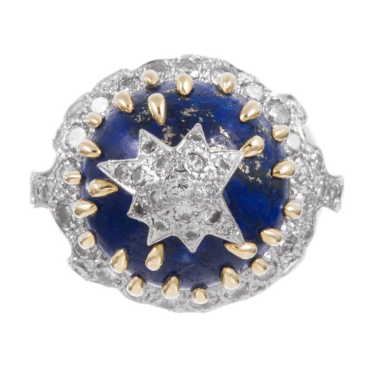 Fabulous dome ring, featuring a polished lapis bullet, crowned with a diamond star and literally dripping with gold. Fabricated in 18k yellow gold and platinum and containing approximately 1.75 carats of diamonds, this looks like the celebrated