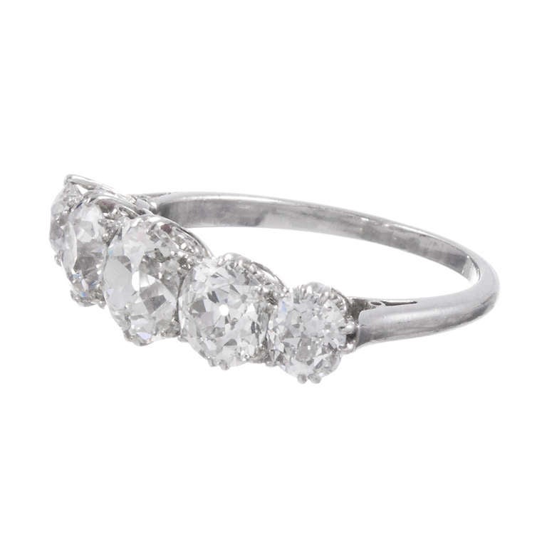 Gently graduated in size, with the smaller stones tapering at the sides, this ring would make a lovely non-tradional, yet super classic engagement ring and can also be 