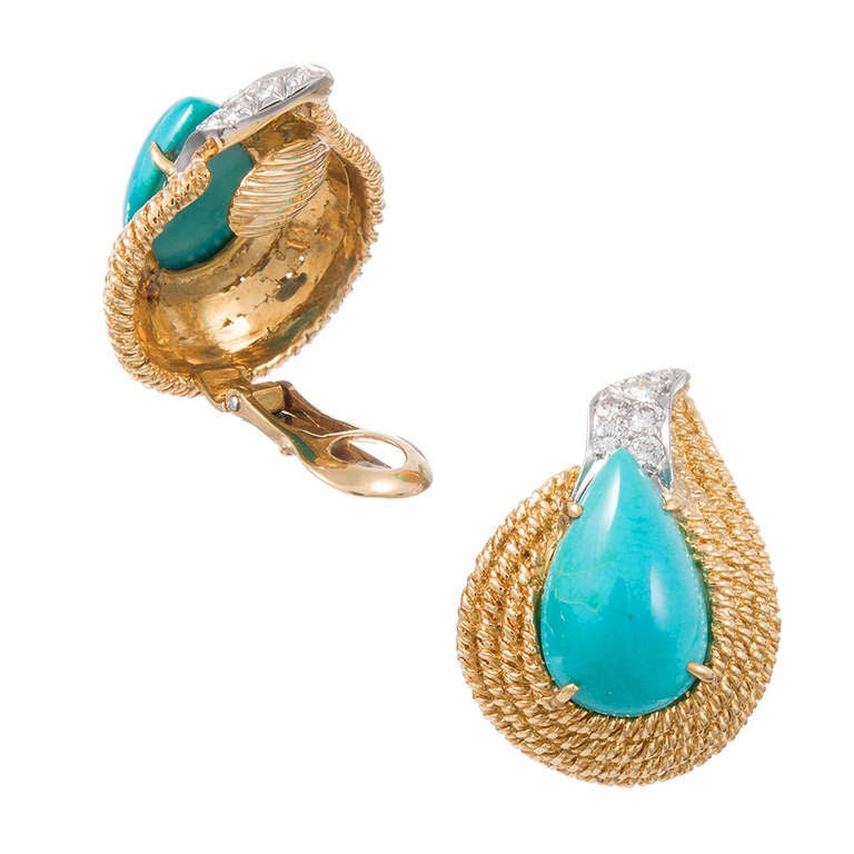 Four rows of twisted golden rope surround fine teardrop-sghaped turquoise and are punctuated with diamonds. Like the flame of a candle, the earrings appear to move, even while fixed on the ear. They contain .74carats of diamonds. Signed David Webb.