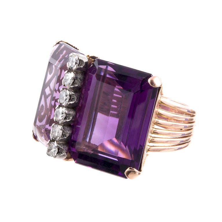 Set in rose and white gold, this unique retro piece would make a delightful cocktail ring or a fun piece of fine fashion jewelry. Each rectangular amethyst weighs approximately 15 carats and is brightened by the addition of a row of six diamonds