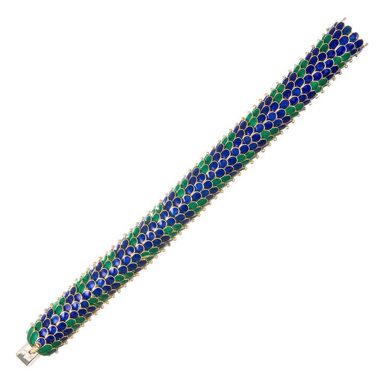 7.25 inches of reptilian-inspried fine jewelry… Intense blue and green enamel scales gently lift and move as you don this lovely bracelet. Resembling a dragon's tail or colorful serpent, this is a masterfully hand-fabricated piece of truly fine