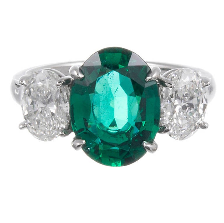 3.01 Carat Oval Emerald Diamond Three Stone Ring at 1stDibs