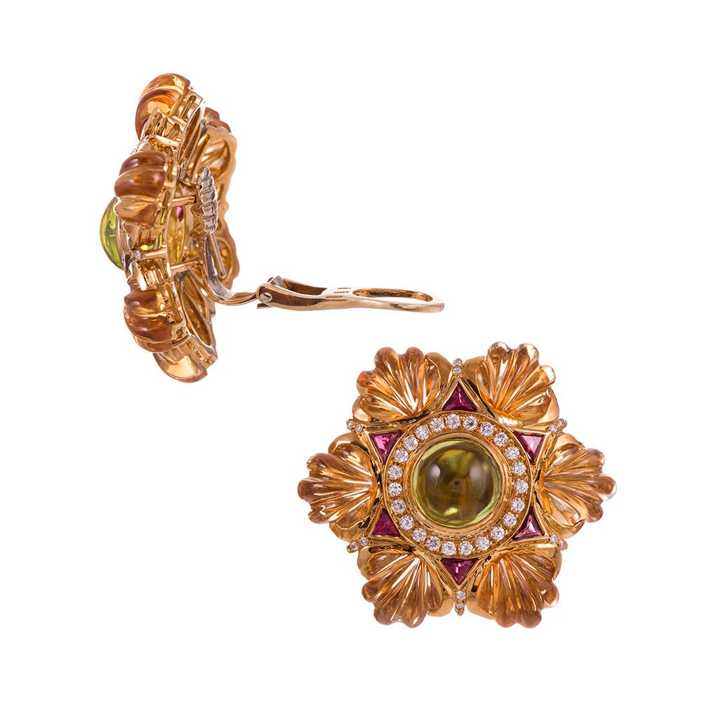 Subtle colors create a gorgeous landscape to grace your ears. The closer you look, the more the detailed finery is evident. These are beautifully composed earrings in every regard! Carved vitrines that resemble scallop shells are coupled with