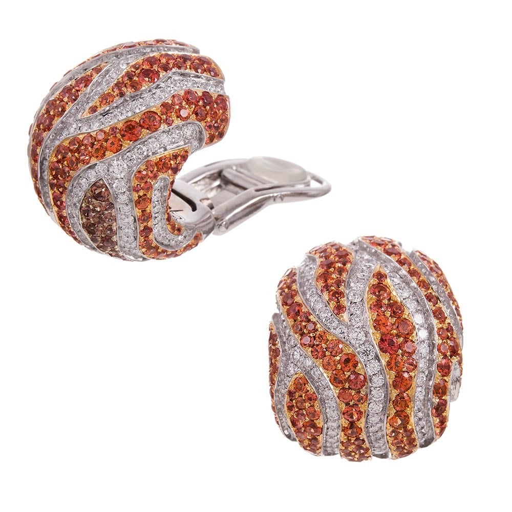 Bold, impressive designs are always expected from DiGrosogno. Whether inspired by inspired by flames or tiger stripes, these will certainly earn some compliments. Set with 19.10 carats of orange sapphires and 4.70 carats of brilliant white diamonds,