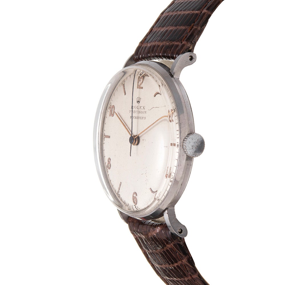 Offered in entirely original condition, this 1940s Rolex dress wristwatch was sold at esteemed Rolex retailer Bucherer in Switzerland. The 