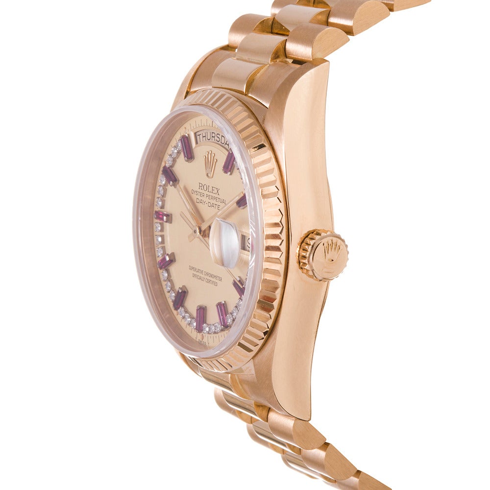 Rolex Yellow Gold Day-Date Wristwatch with Baguette Ruby and Diamond circa 1980s
