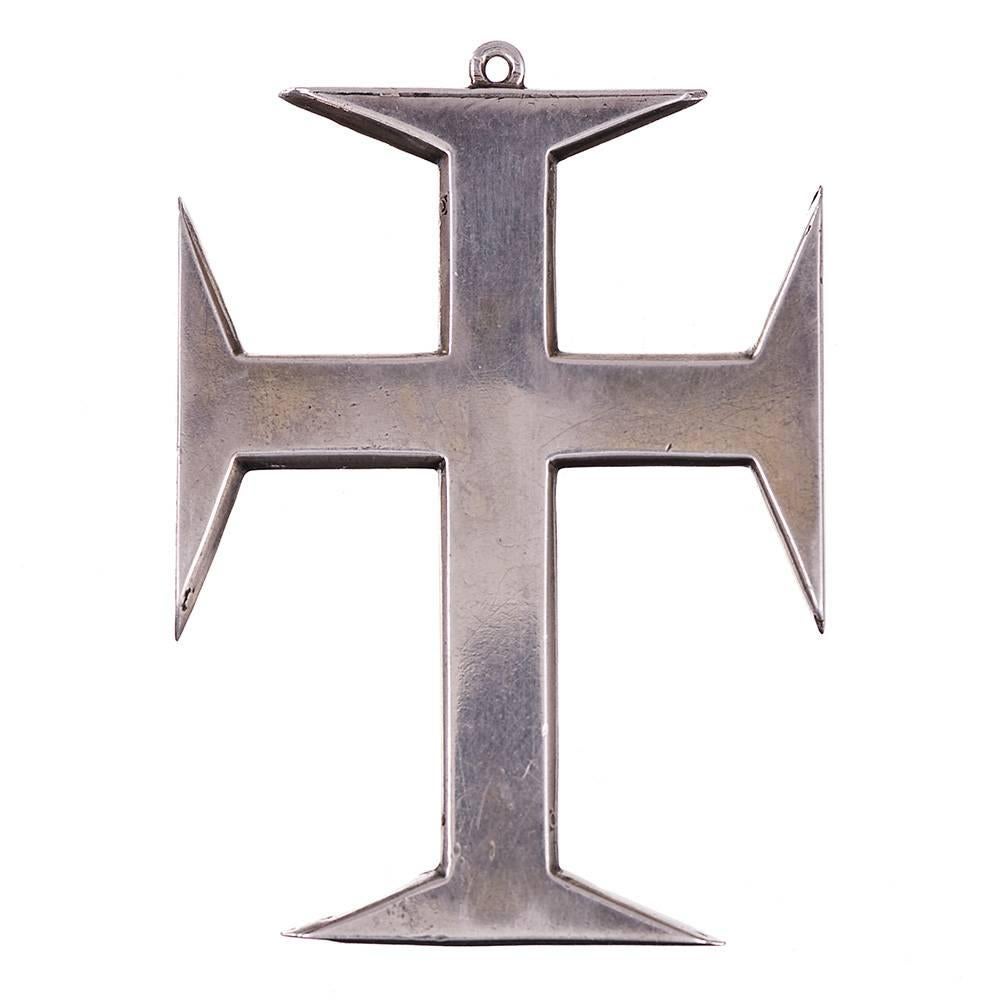 This is a genuine antique treasure. The cross is a symbol of the Church of Jesus Christ in Jerusalem and was created in Spain or Portugal in the Georgian era, between 1680 and 1750. It is made of silver and set with garnets and paste. The impressive