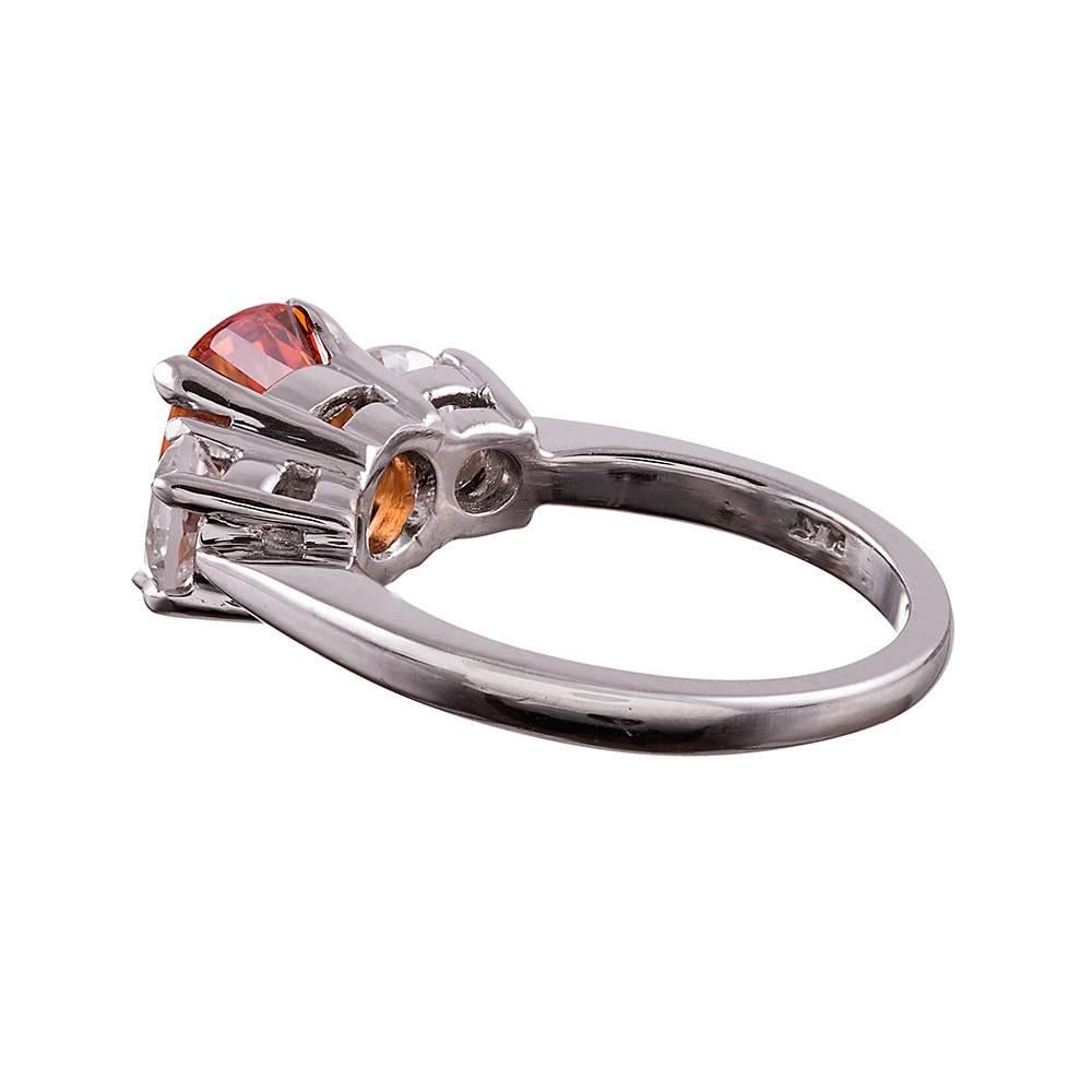 For the non-traditional bride, the gemstone enthusiast who appreciates novelties not often found or she who wishes to add a special piece that no one else will have to her jewel box, we offer this gem fine vivid orange garnet and diamond ring. This