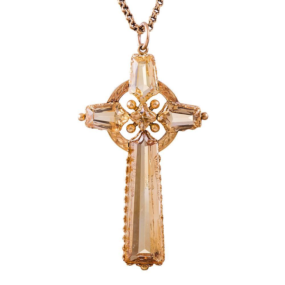 Measuring an impressive 3 inches tall and 1.75 inches wide, this finely detailed Victorian cross combines five sections of citrine with handmade golden frames. The result is a cross pendant that is subtle and wearable, despite its assertive size.
