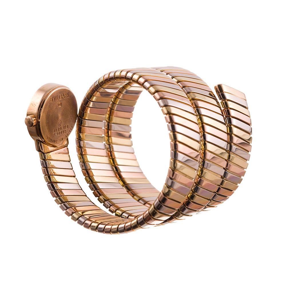 Made of 18 karat white-, yellow- and rose gold and guarded in excellent original condition, this iconic Bulgari design coils around your wrist in a serpentine display that bridges the gap between a timepiece and a piece of fine jewelry. 