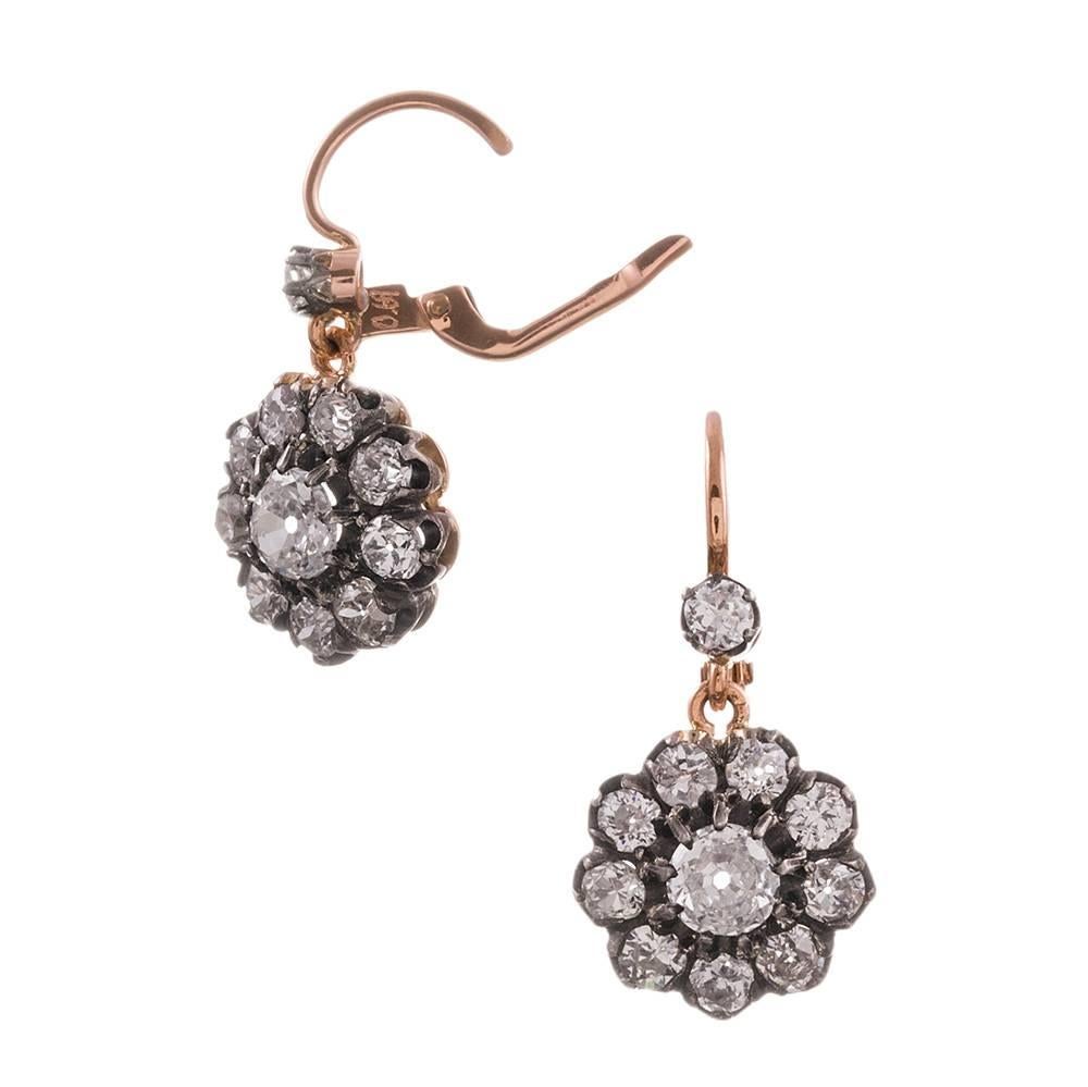 Oozing antique charm, these diamond drop earrings strike the ideal balance between formal and casual, loaded up with enough diamonds to make them look important, yet measuring just under an inch in overall length, so they may be worn daily. In