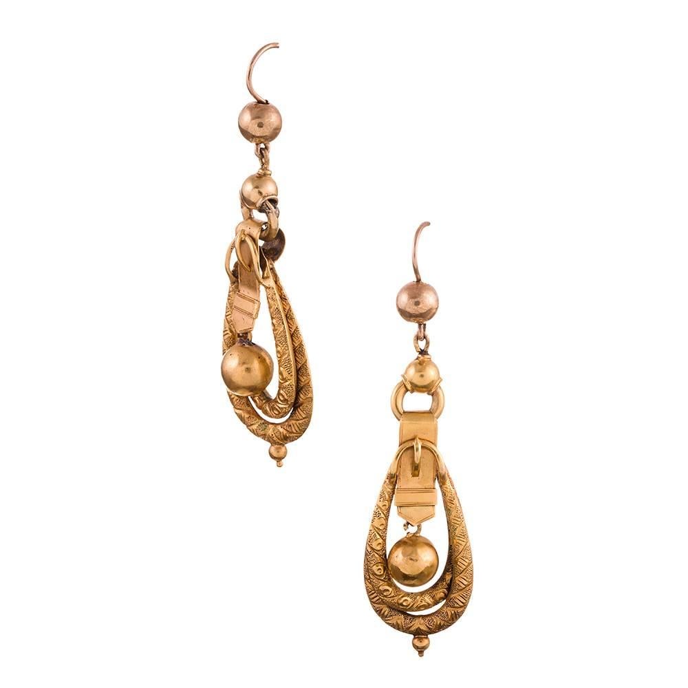 Hand made of 15 karat yellow gold, these “buckle motif” earrings are the ideal size for daily wear, yet could transition without effort to evening. Queen Victoria would have approved, as she was a fan of jewelry decorated with this theme. They