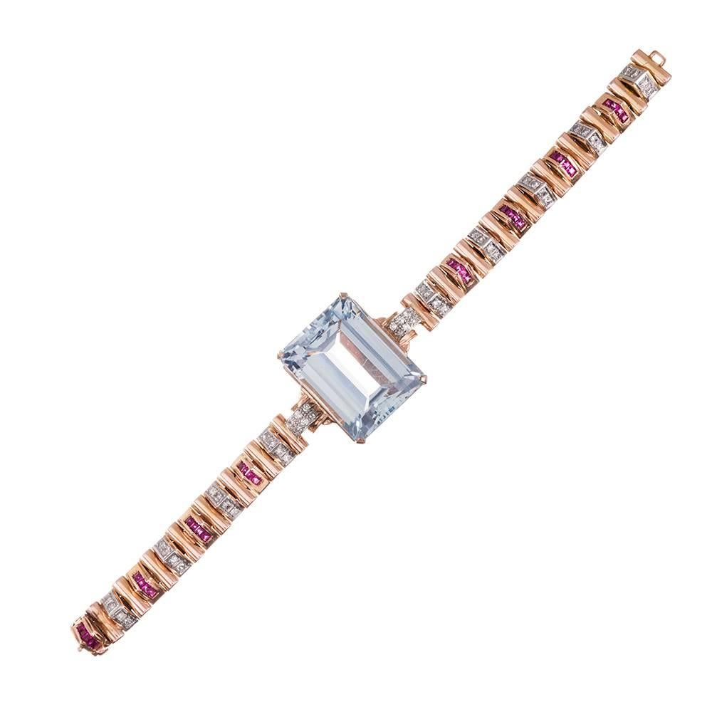An incredible bracelet that will make you smile! A classic piece, celebrating genuine retro style and combining the best elements of the era. Made of 18 karat rose gold and set with a most impressive 68.50 carat aquamarine in the center. The