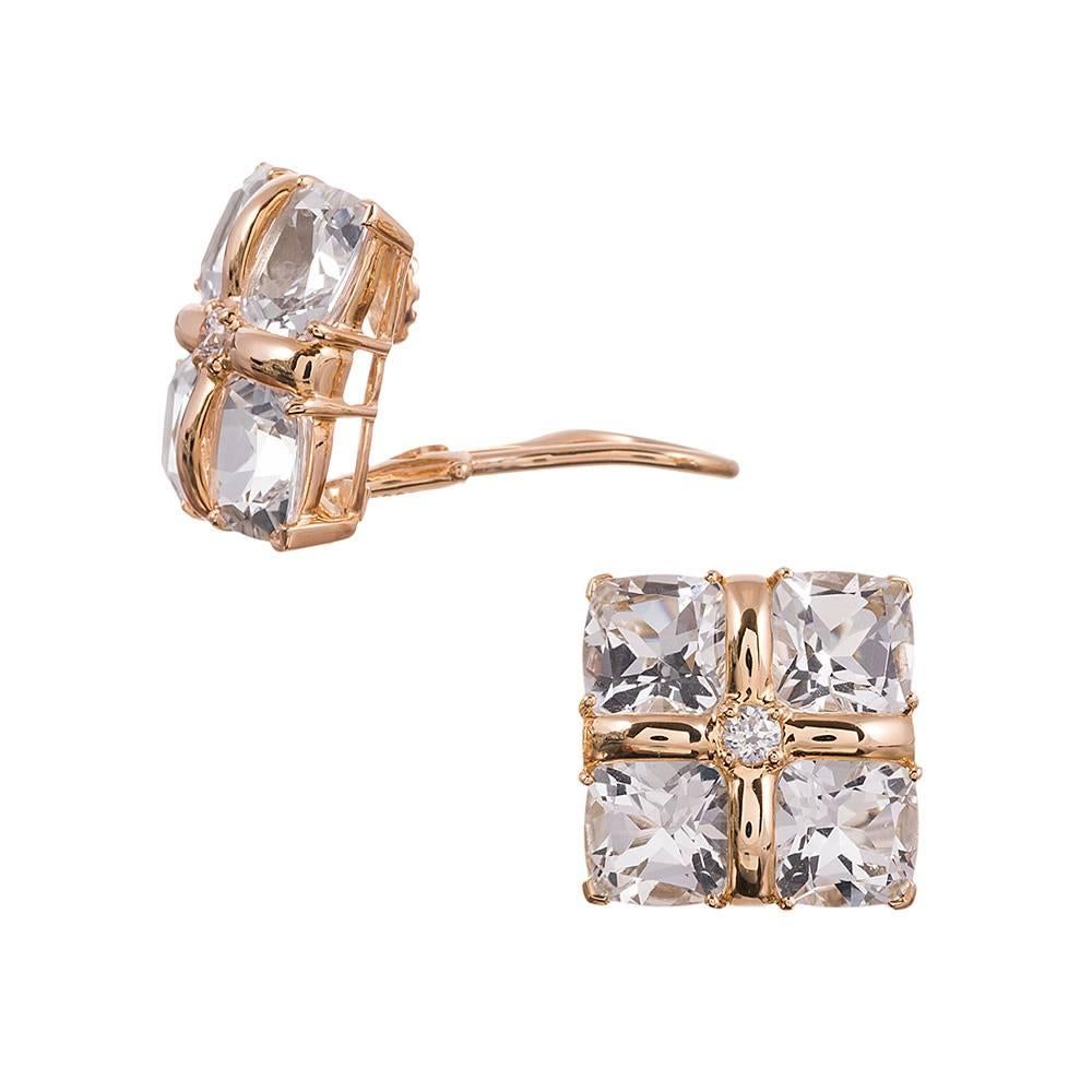 A sophisticated and glamorous design, compliments of iconic American jeweler Seaman Schepps. Four identical faceted rock crystal sections are anchored by a center brilliant round white diamond and fashioned into a square with 18 karat yellow gold.
