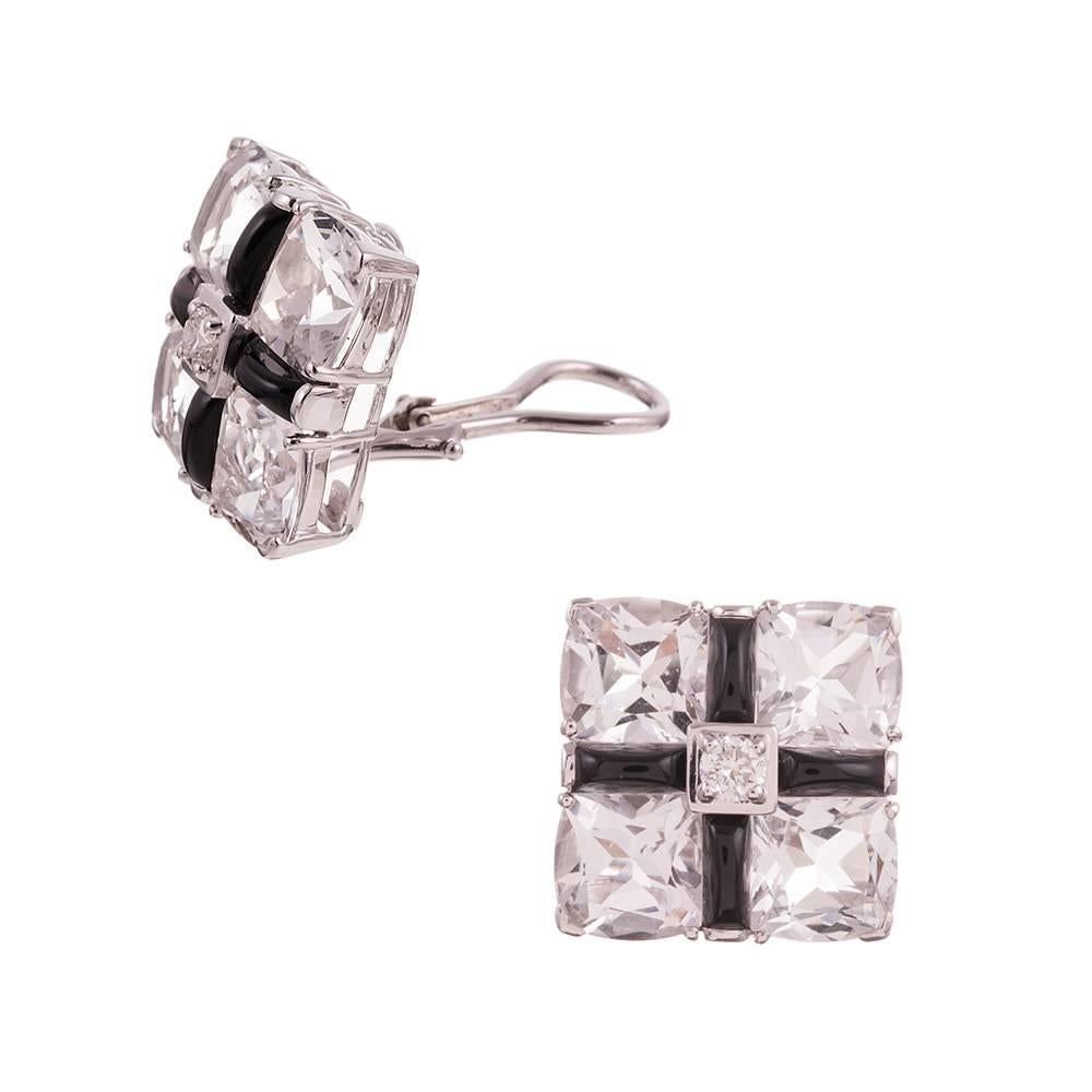 A sophisticated and glamorous design, compliments of iconic American jeweler Seaman Schepps. Four identical faceted rock crystal sections are anchored by a center brilliant round white diamond and fashioned into a square with onyx bars and 18 karat