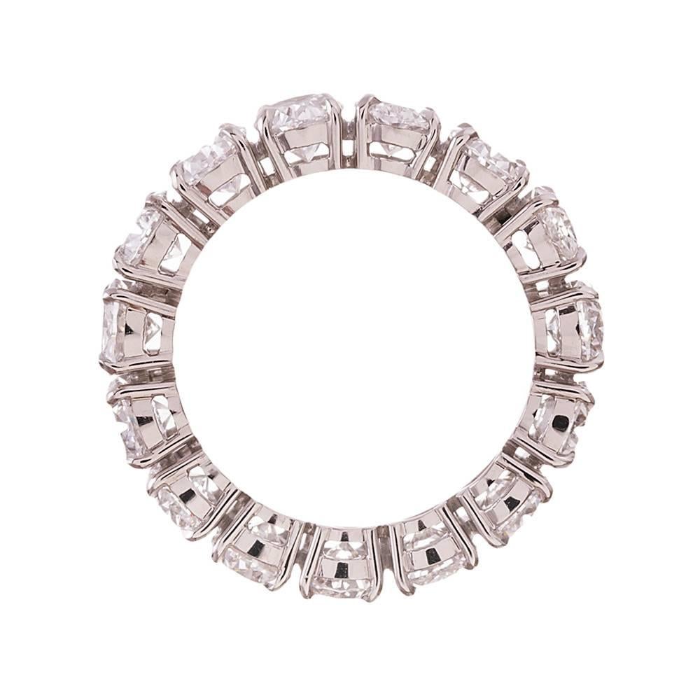 Fifteen ideally matched diamonds, each GIA graded from D to G color and from Vvs2 to Si1 clarity, are formed into a never-ending circle of brilliance to grace your finger. In total, there are 7.65 carats of diamonds to satisfy your desire for