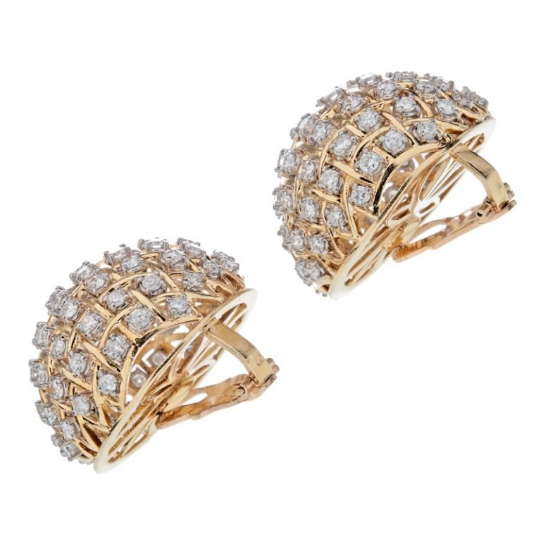 Impressive scale and craftsmanship are present in these massive dome earrings. The gold domes are blanketed with 152 Round Brilliant Cut diamonds weighing 10 carats total.