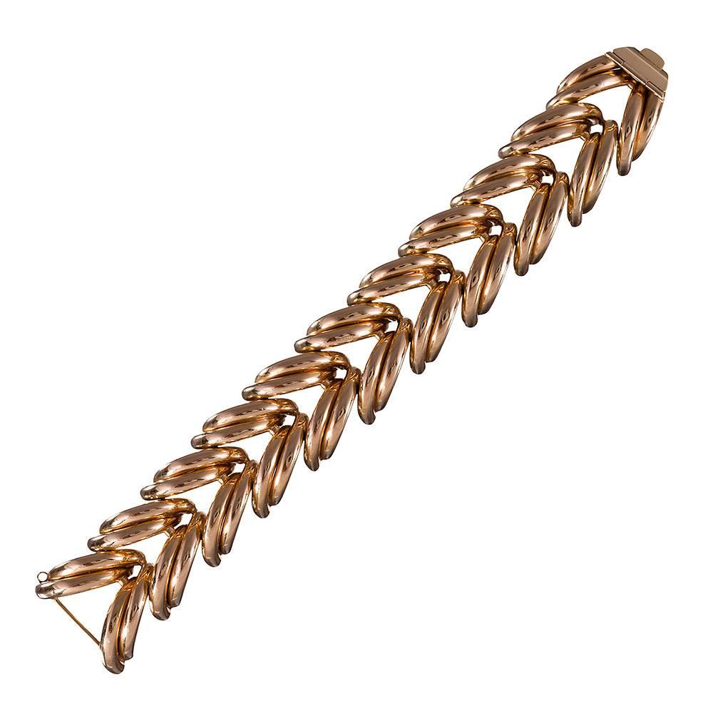 14k rose gold retro bracelet, beautifully styled polished strokes that encircle the wrist in never-ending splendor. The absence of diamonds or gemstones make this suitable for professional, elegant or more casual attire, yet the look remains bold