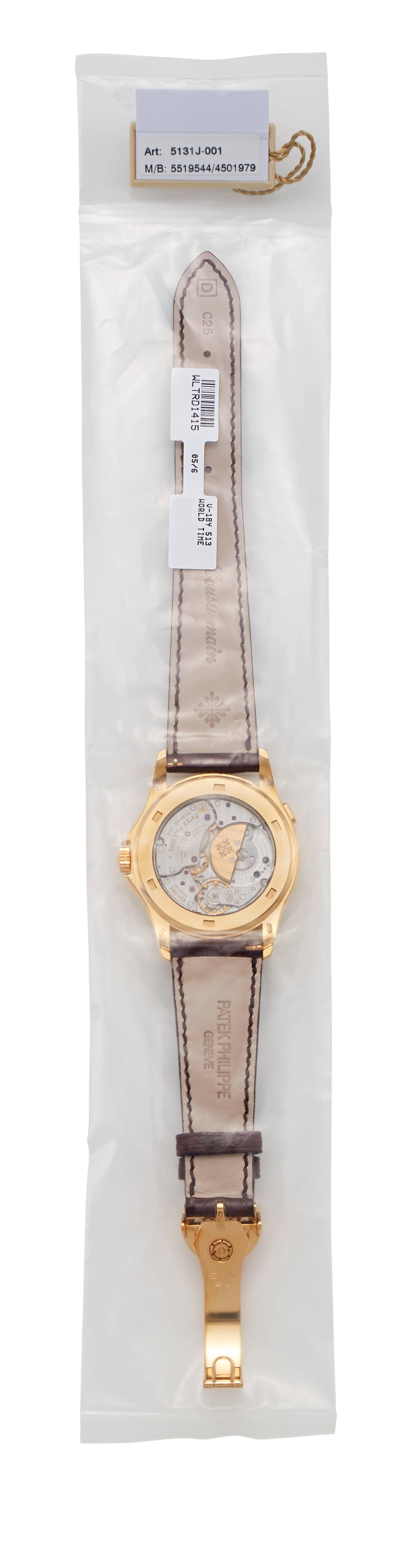 Vintage Patek Philippe 5131J-001 

The watch features an automatic movement with an exhibition back. The watch
is factory sealed.  Movement:  5519571/4501974

Celebrated World Time watch, with a finely executed cloisonée enamel center dial, in 18k