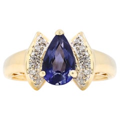 Magnifique bague grappe de tanzanites et de diamants de 0,71 carat en or jaune 14 carats