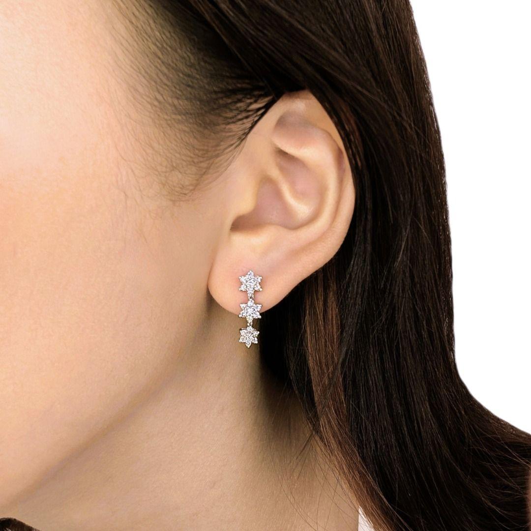Illuminate your look with the ethereal brilliance of these 0.42-carat natural diamond earrings, delicately set in 18K white gold. Featuring 42 round brilliant diamonds, each stone glows with a refined G-H color and VS-SI clarity, ensuring a