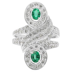 Magnificent 0.60ct Emerald and 1.21ct Diamond Bypass Halo Cocktail Ring