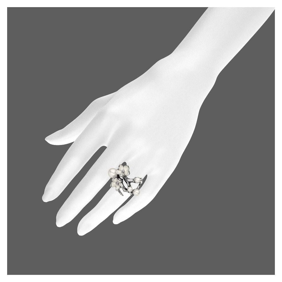 White Diamond, Freshwater Pearl, Enamel and Sterling Silver Blossom Ring from the Shaun Leane 'Cherry Blossom' silver jewellery collection. 
Metal: Sterling silver 
0.14ct VS2 excellent-cut white diamond
Cold Enamel 
Hallmarked SL at the London