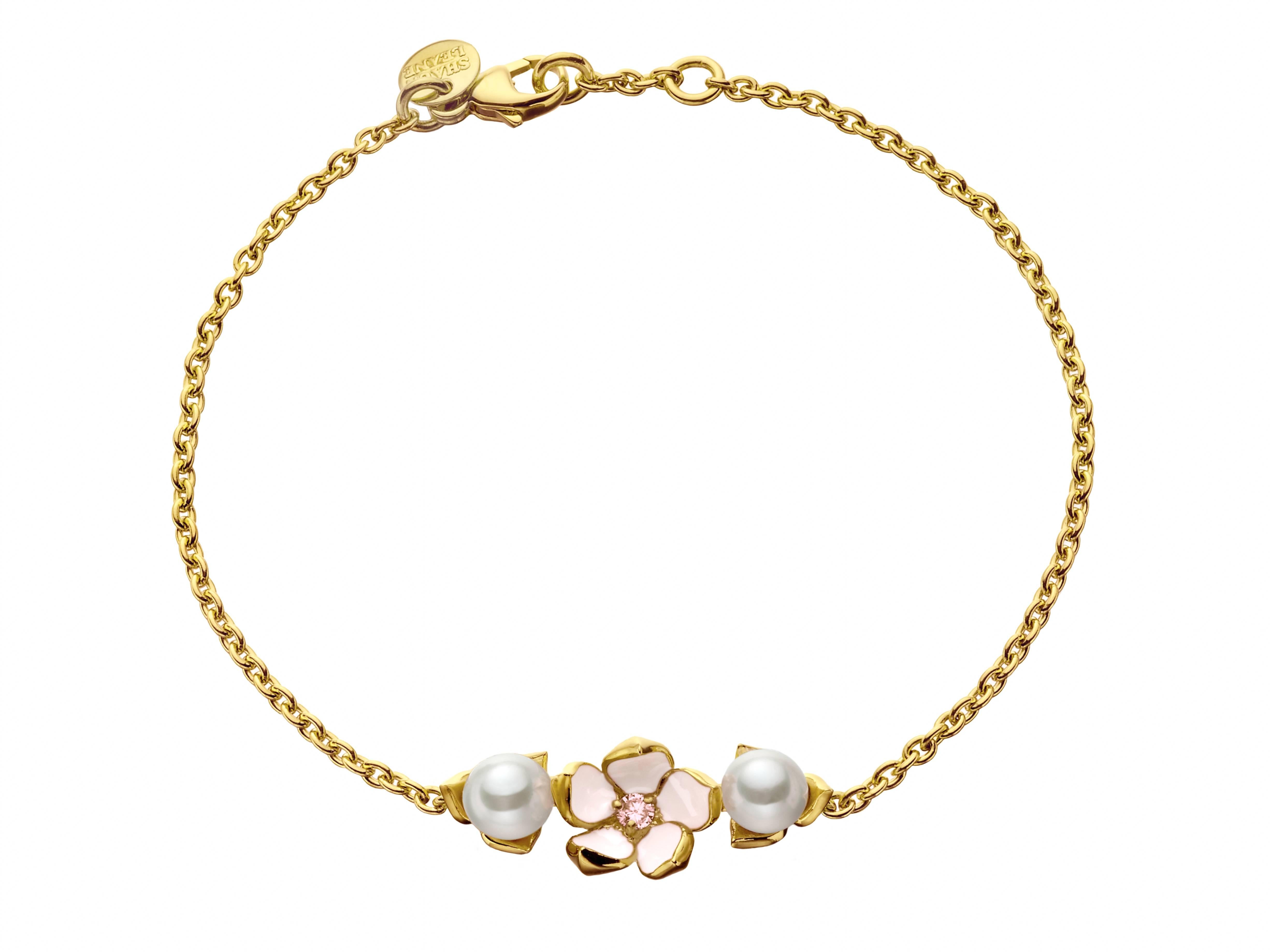 18ct yellow Gold Vermeil and Sterling Silver White Diamond, Freshwater Pearl, Enamel and Sterling Silver Single Flower Bracelet from the Shaun Leane 'Cherry Blossom' silver jewellery collection. 
Metal: Sterling silver with Yellow Gold Vermeil 
2