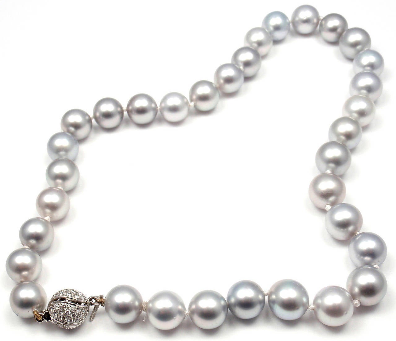 18k White Gold & Platinum Diamond One Strand Pearl Necklace by Harry Winston. 
With 33 Tahitian Cultured pearls from 10mm - 12mm in diameter on a 16