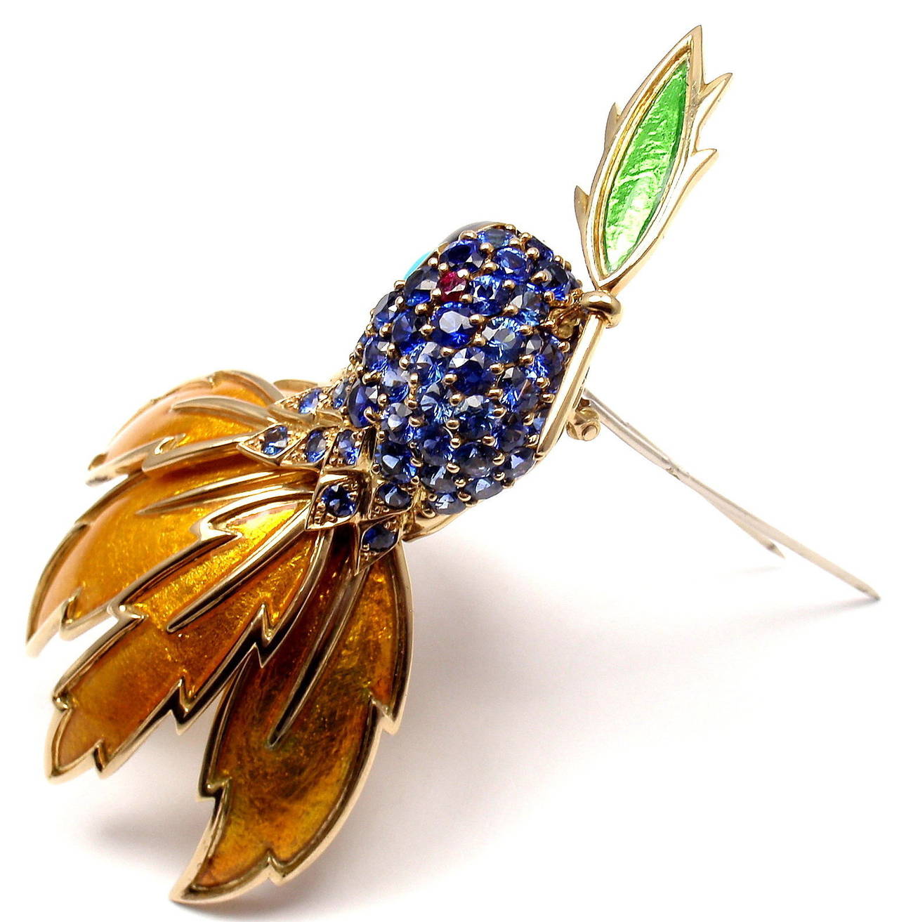 18k Gold Sapphire Ruby Turquoise Enamel Parrot Brooch/Pin by Jean Schlumberger for Tiffany & Co. 
With 75 round sapphires total weight approx. 12ct
1 black onyx
1 round ruby
1 Turquoise

Details: 
Measurements: 3