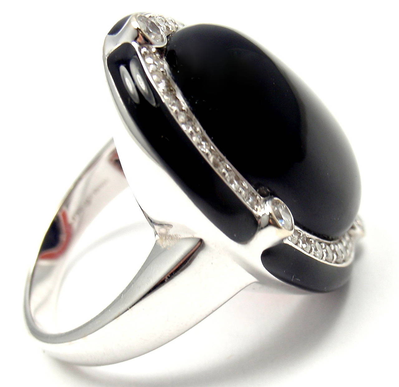 18k White Gold Diamond Large Black Onyx Ring by Ivanka Trump.
With 36 Round Brilliant cut diamonds .75ct VS clarity, G color
1 Oval shape large black onyx stone 20mm x 16mm

Details:
Ring Size: 7 3/4 (resizing is available)
Weight: 15.1