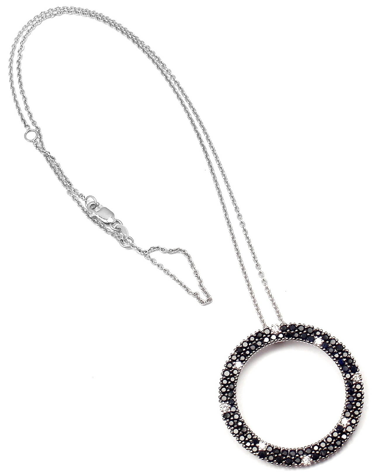 18k White Gold Fantasia Diamond Black Sapphire Pendant Necklace by Roberto Coin. 
With 8 round brilliant cut diamonds SI1 clarity, G color total weight .26ct
2ct in round black sapphires

Details: 
Necklace: 17.5'' inches long
Pendant:  1