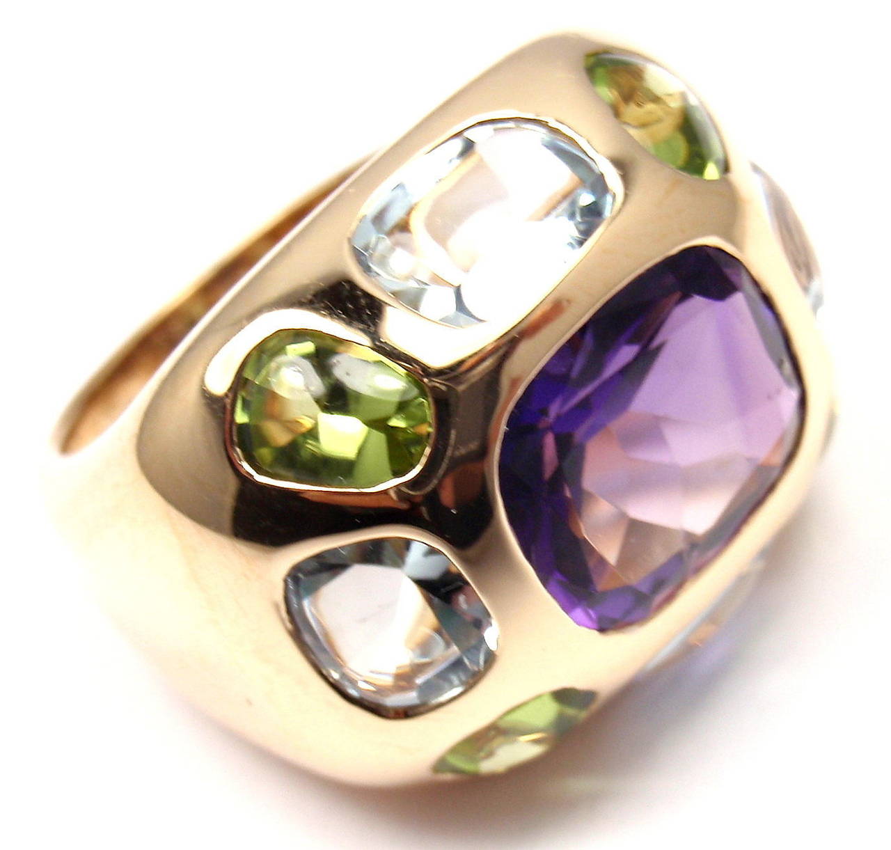 18k Yellow Gold Baroque Amethyst Aquamarine Peridot Ring by Chanel. 
With 1 Amethyst: 9mm x 11mm
4 Peridots: 4mm x 5mm
4 Aquamarines: 4mm x 5mm

Details: 
Size: 5 3/4
Width: 18mm
Weight: 14.5 grams
Stamped Hallmarks: Chanel 750